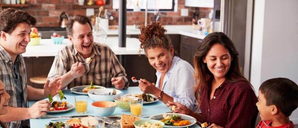 Family eating dinner together and having fun